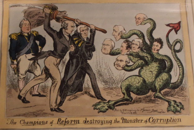 Cartoon-Illustration von Reform-Vertretern, die ein Korruptionssymbol besiegen, mit begleitendem Text: "Die Champions der Reform zerstören das Monster der Korruption."
